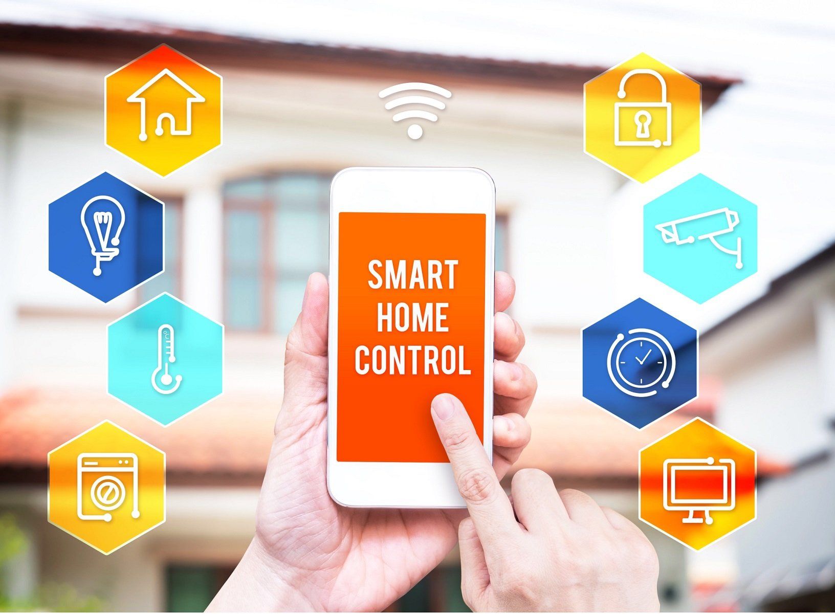 A person is holding a smart home control phone in front of a house