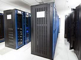 A row of servers are lined up in a data center.