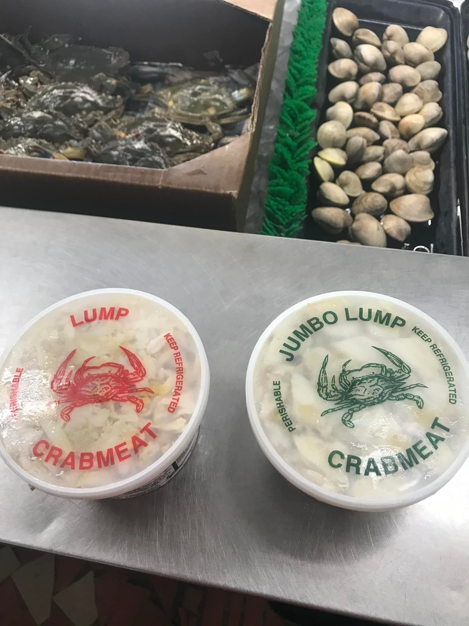 Two tubs of crab meat labeled 