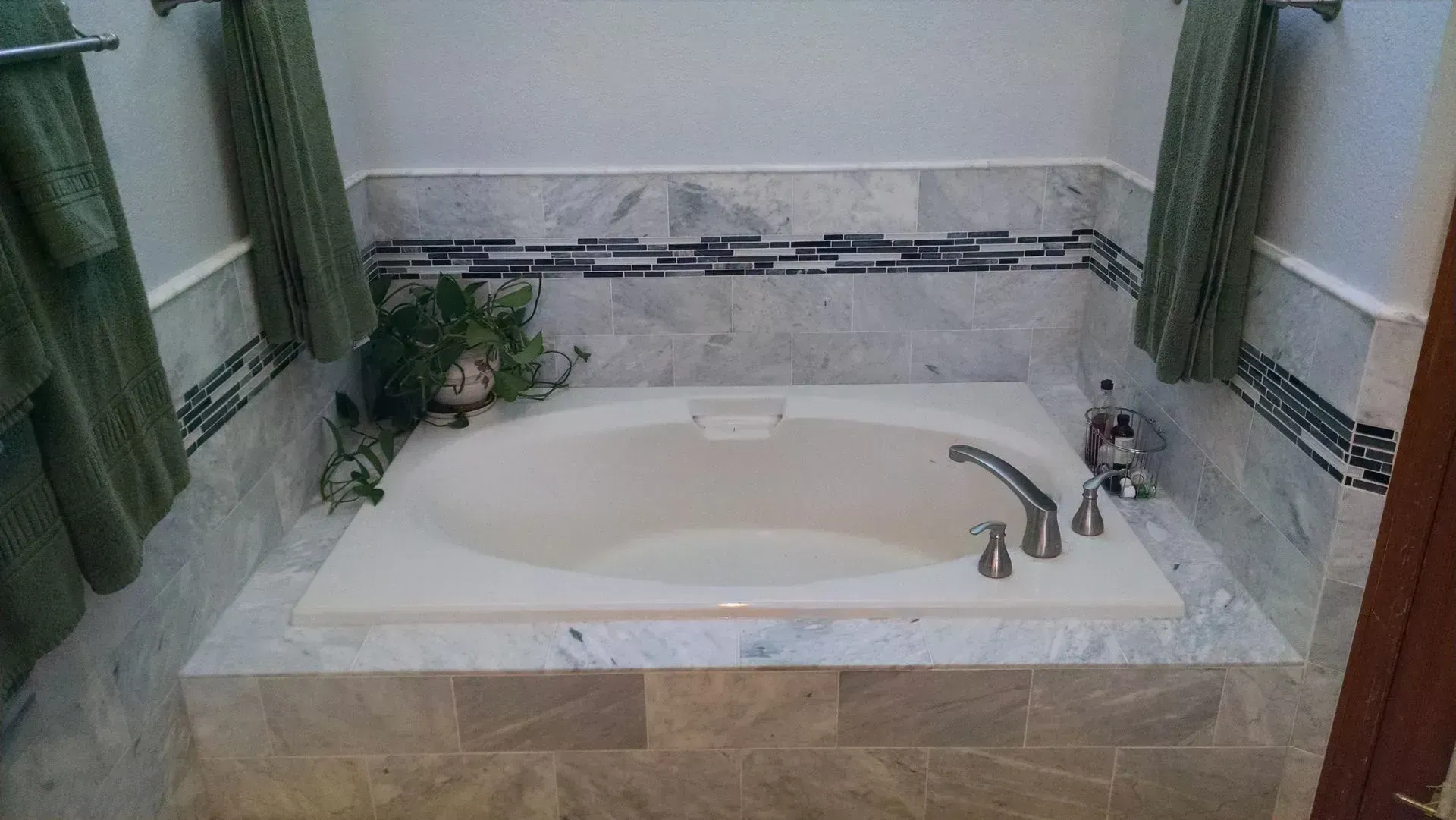 There is a bathtub in the middle of the bathroom.