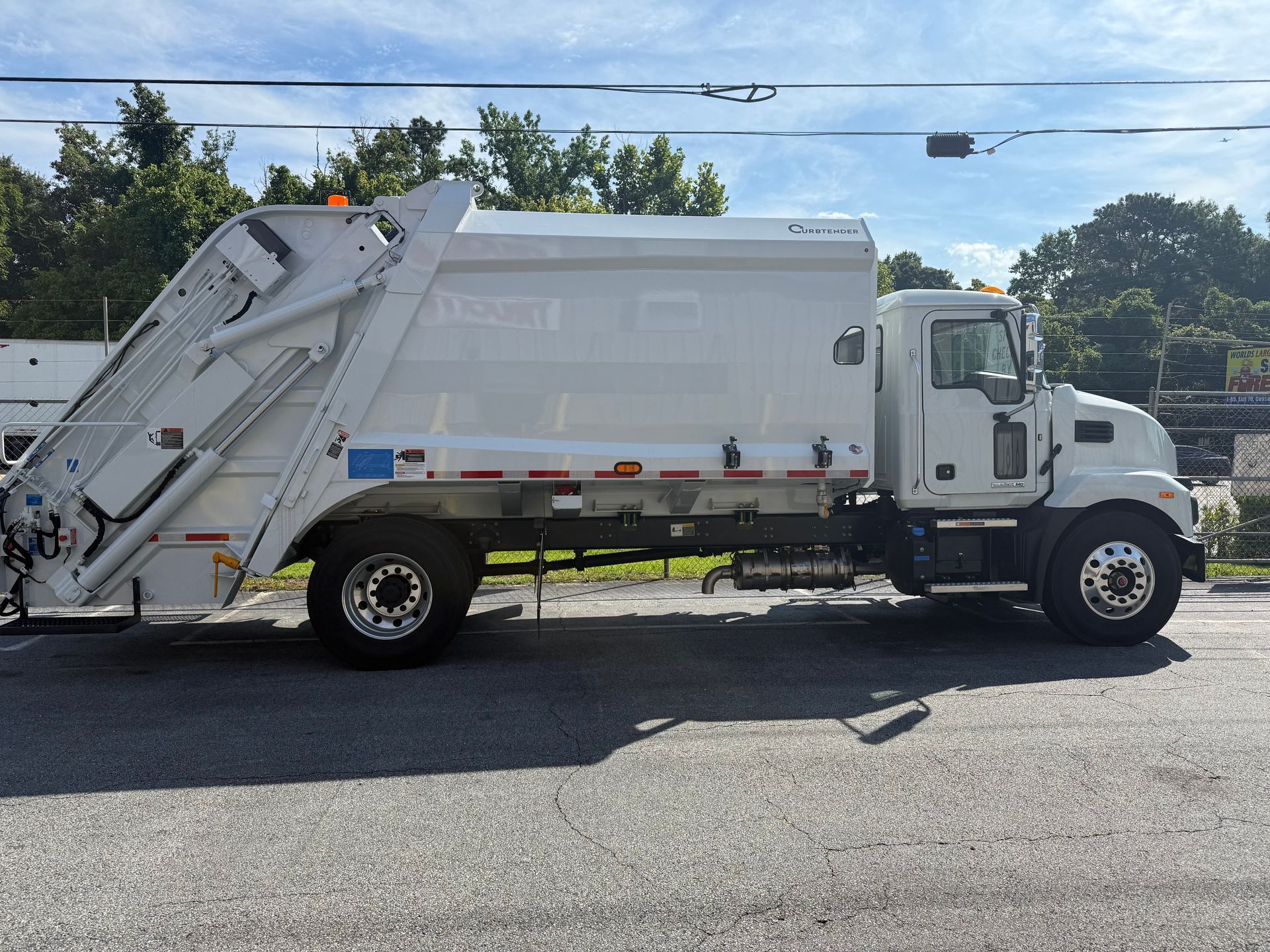 A dump truck is parked in a parking lot.