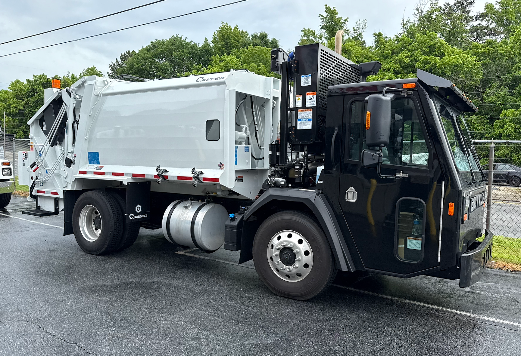 A striker truck is parked in a parking lot