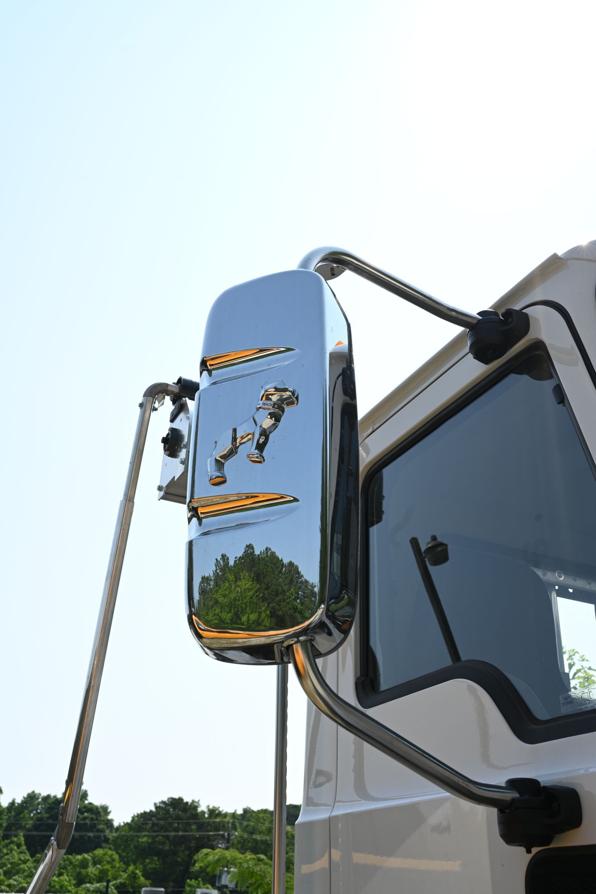 A close up of a side view mirror on a truck.