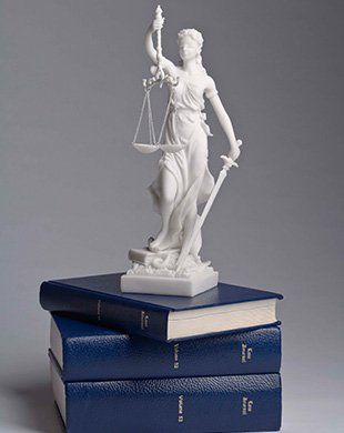Lady Justice on top of books