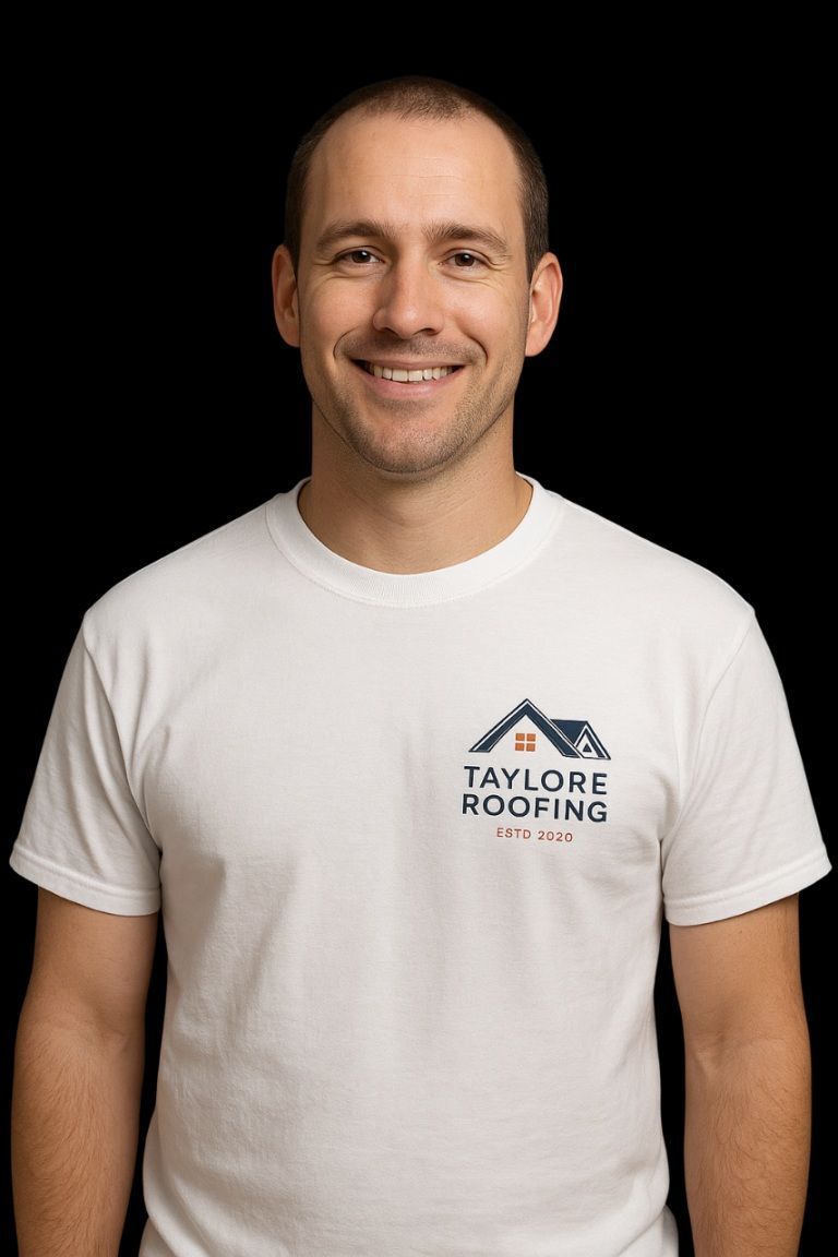 Smiling man in white T-shirt with roofing company logo on black background