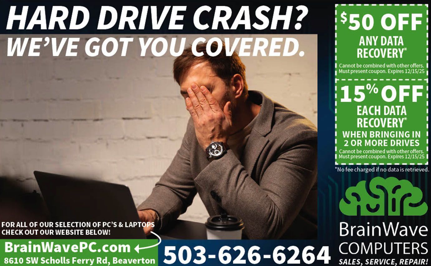 Man stressed at laptop, ad for BrainWave Computers. Offers data recovery services with discounts.