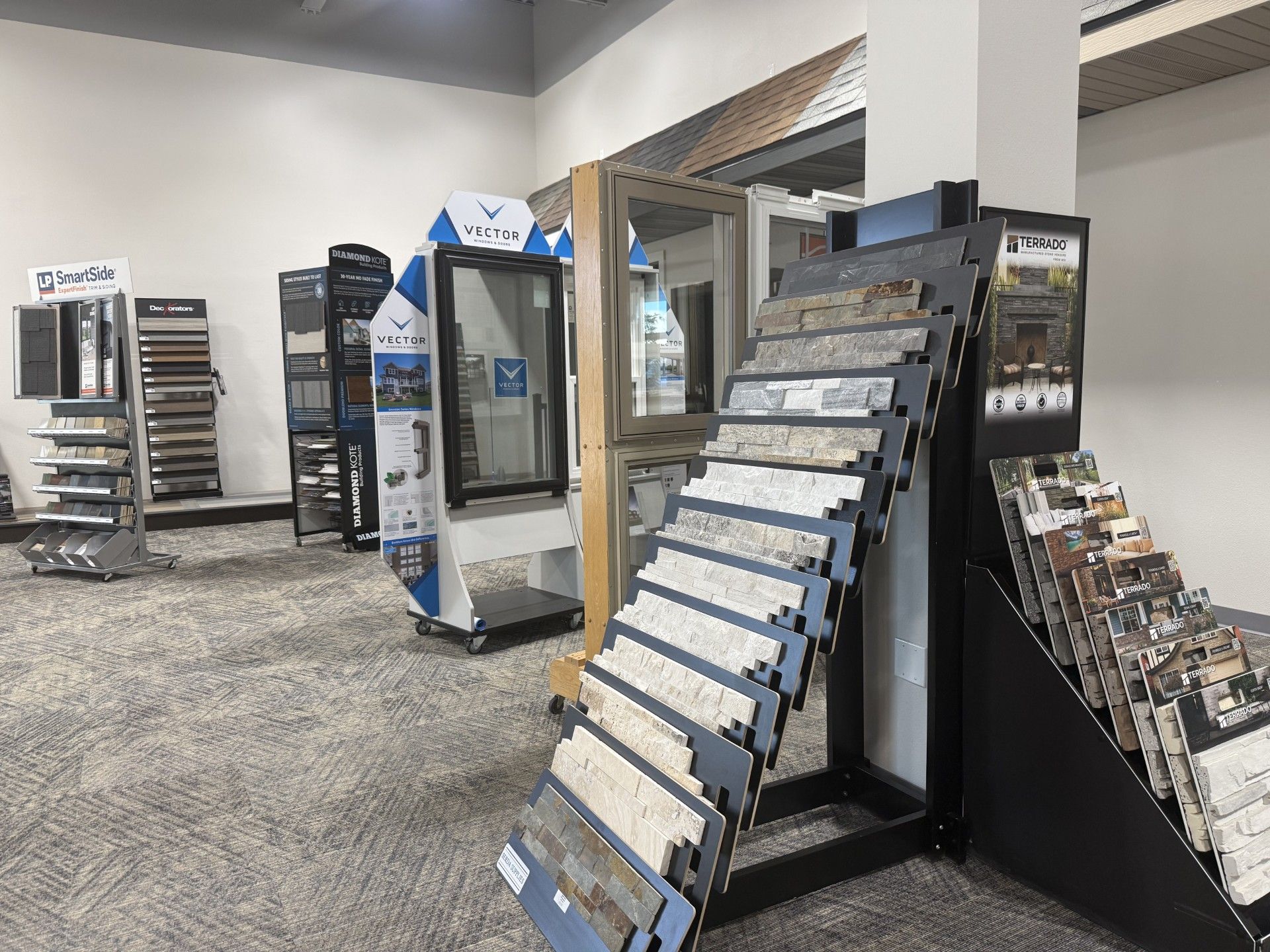A showroom filled with lots of displays of tiles and windows.
