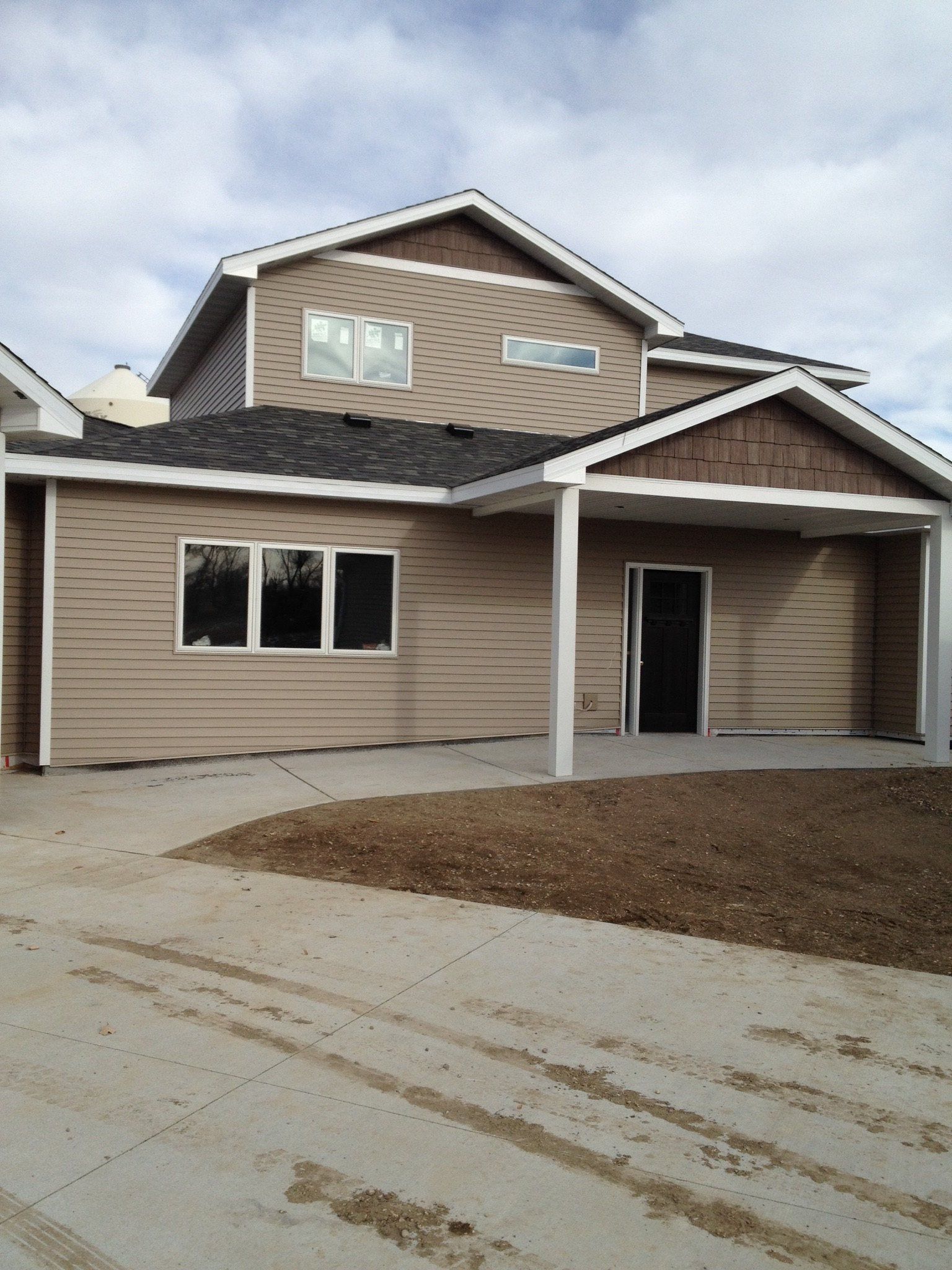 A house with a lot of windows and a garage