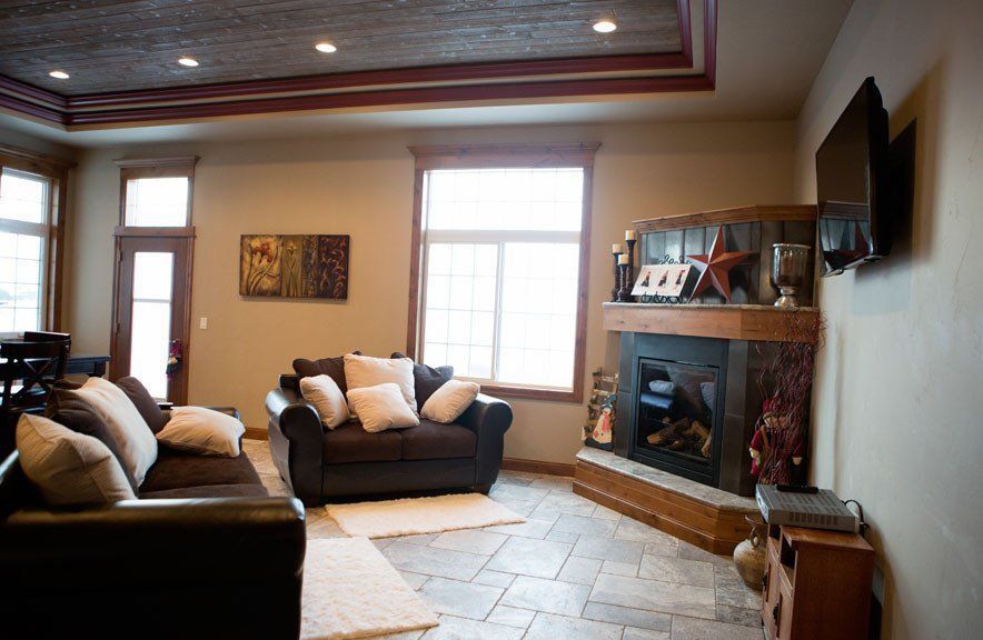 A living room with a fireplace and a couch
