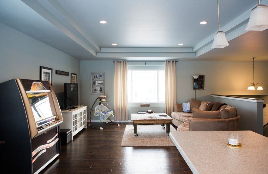 A living room with a couch and a jukebox