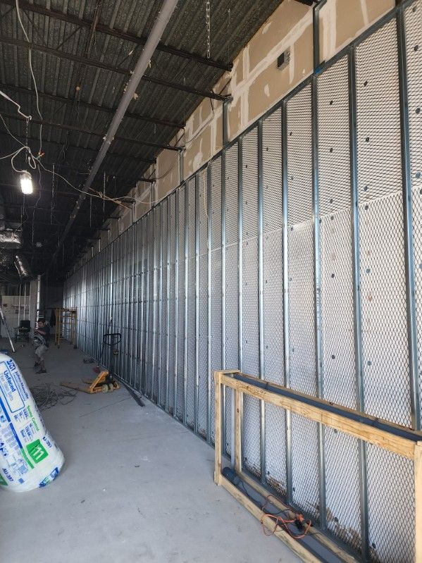 A large room with a lot of walls being built