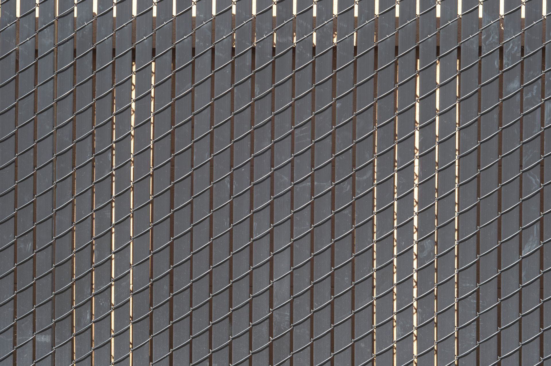 A close up of a metal mesh with a grid pattern