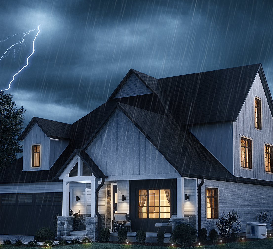Stormy night over a lit suburban house with rain and a lightning strike in the sky
