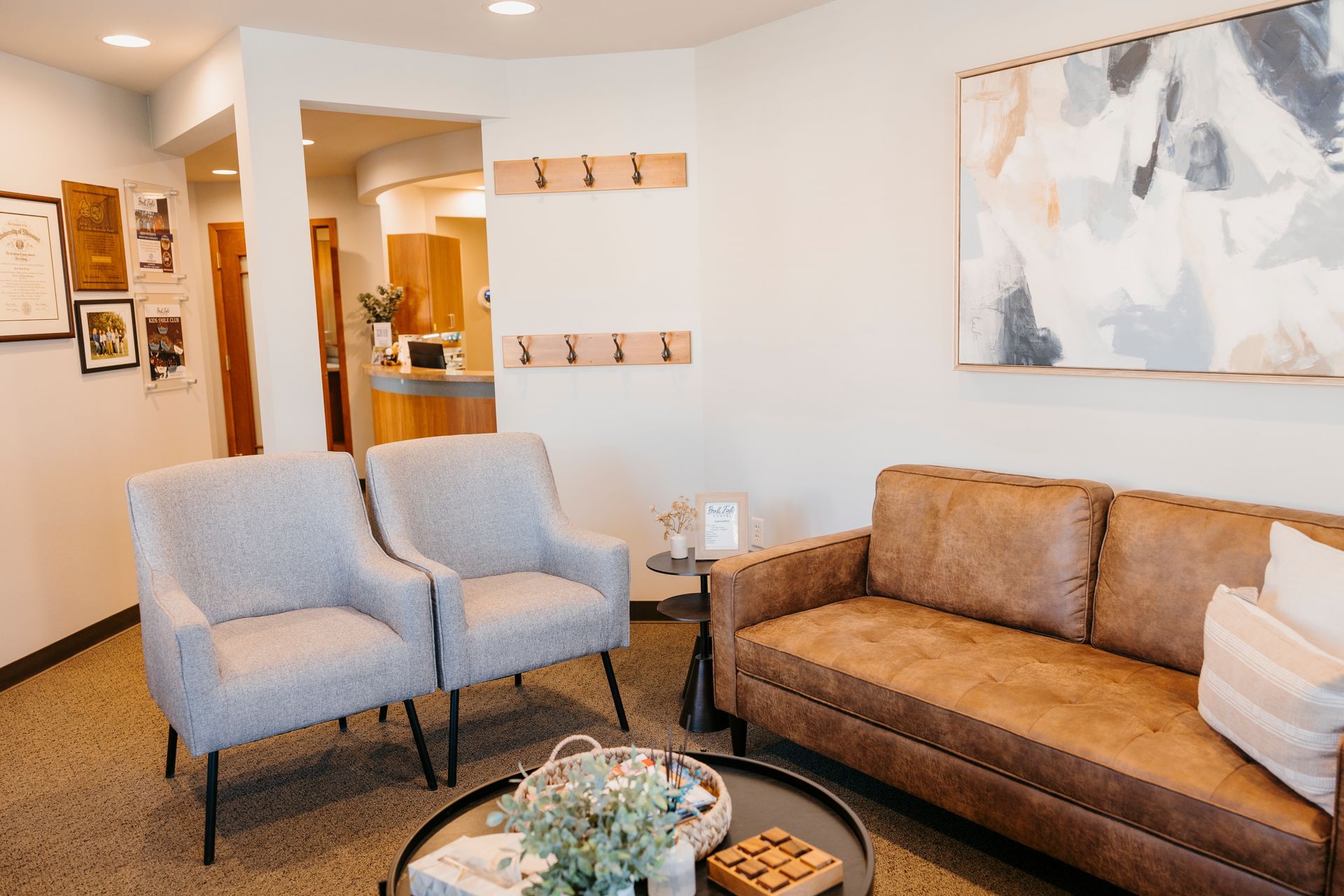 There is a couch and chairs in the waiting room.