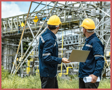 Two engineers in yellow hard hats 
