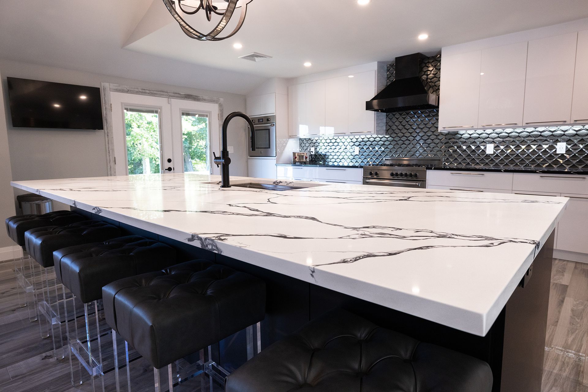 There is a large island in the middle of the kitchen.