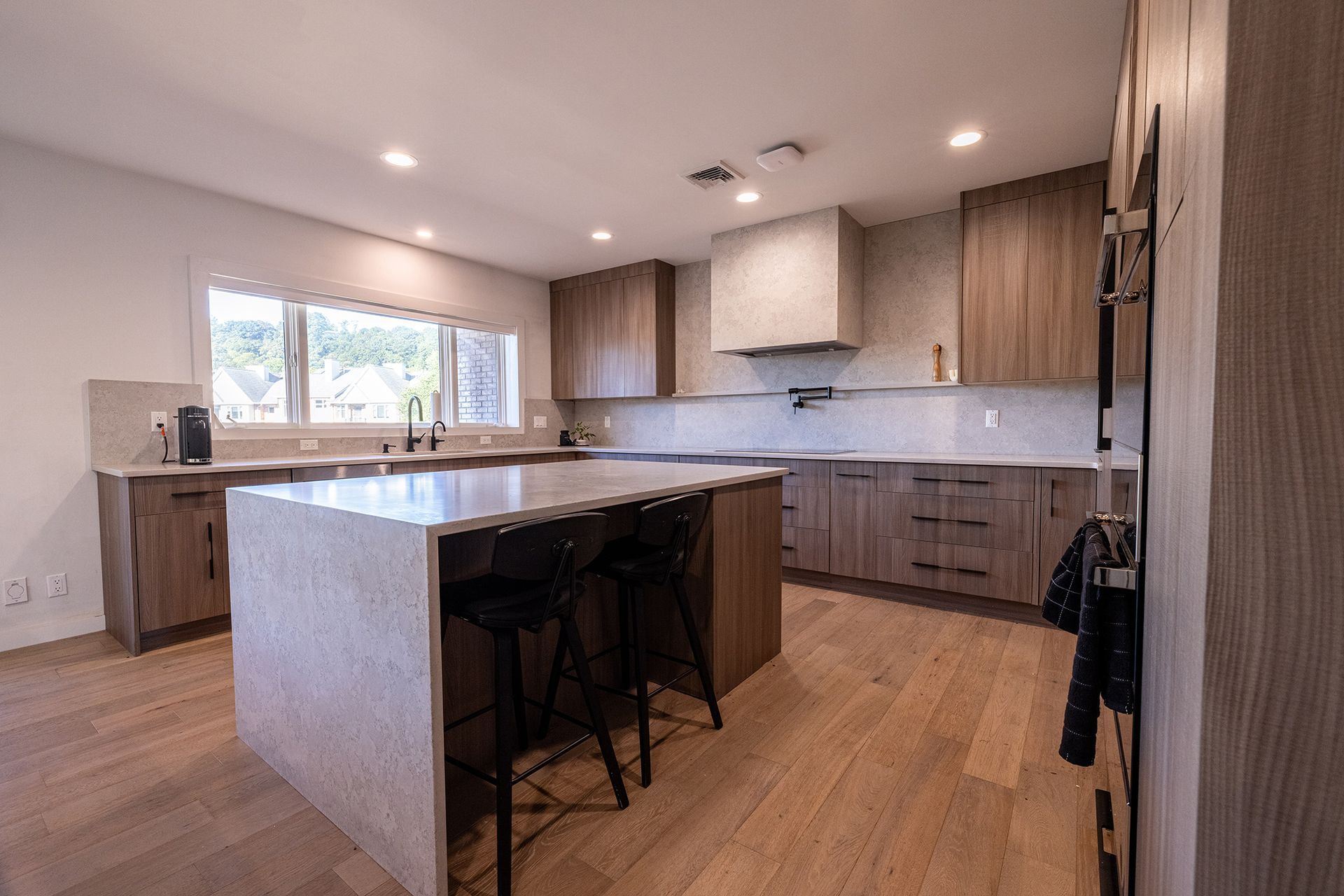 A kitchen with a large island in the middle of the room.