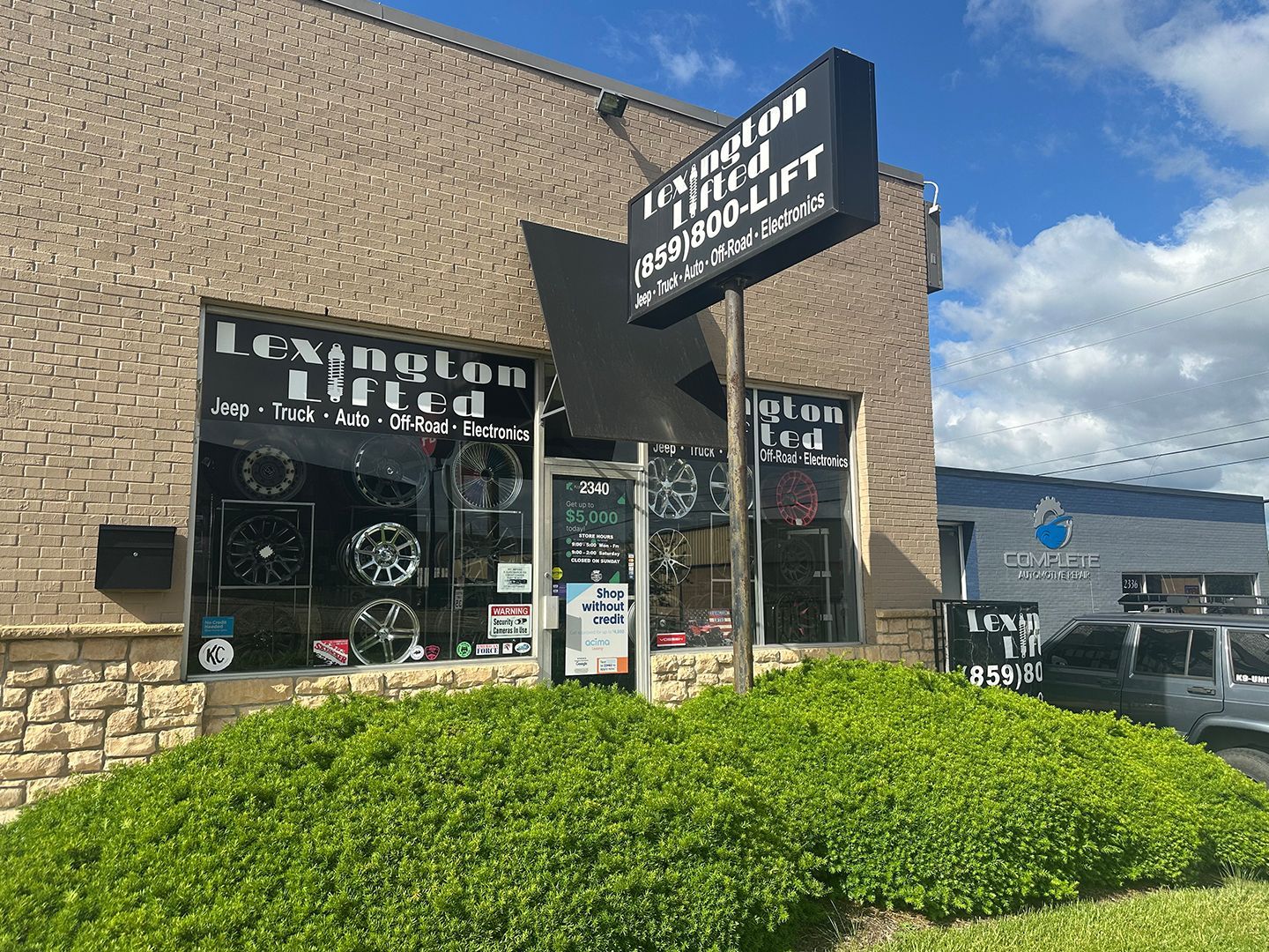 A building with a sign on the side of it that says Washington tire specialist.