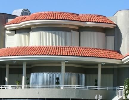A large building with a red tile roof