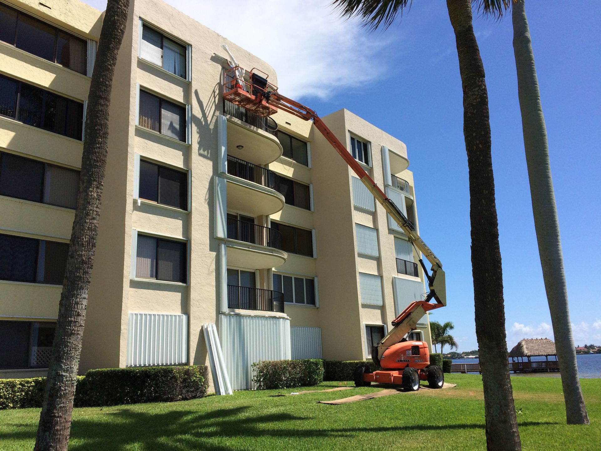 A large building with a crane on the side of it