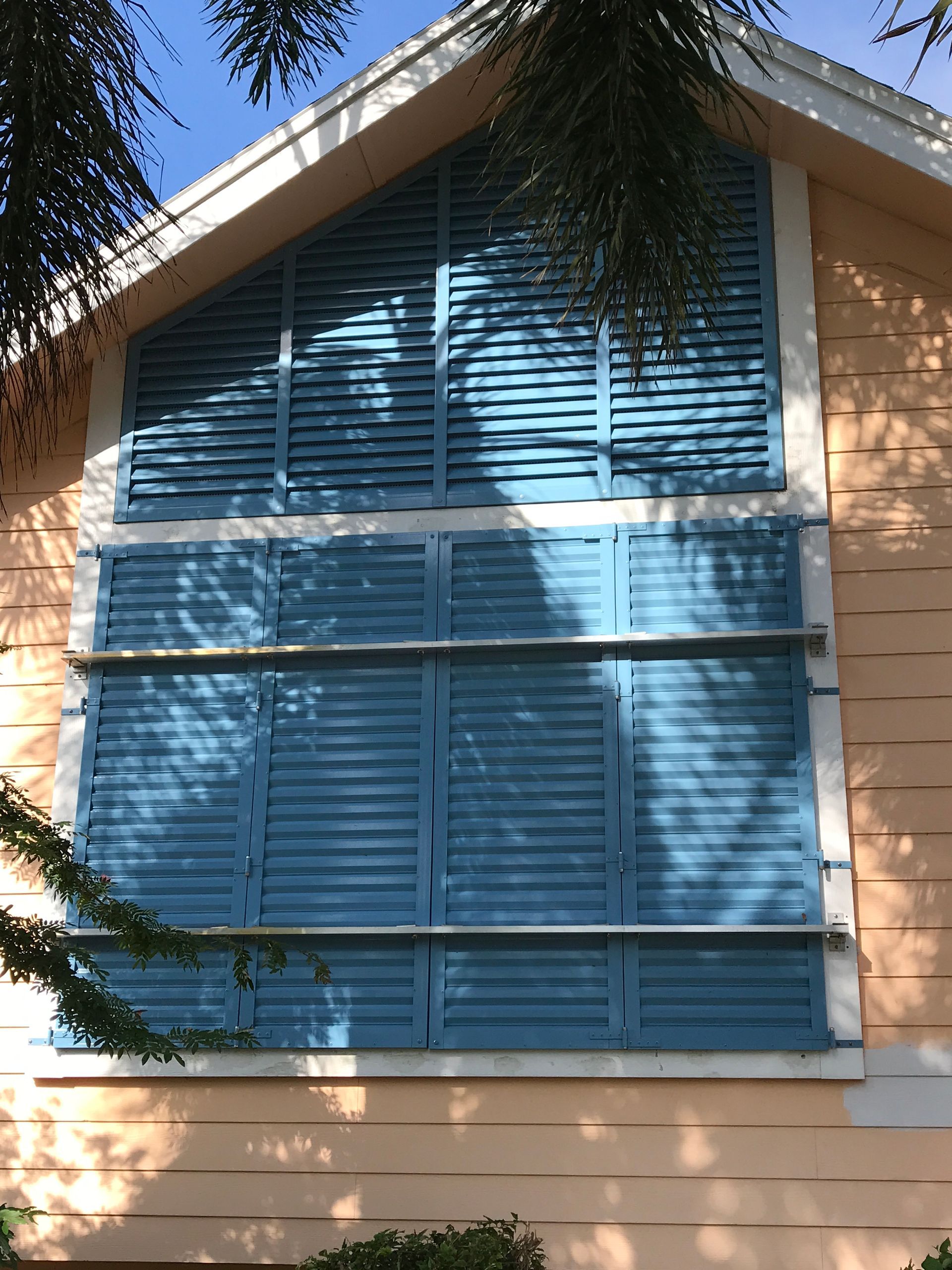 A house with blue shutters on the windows
