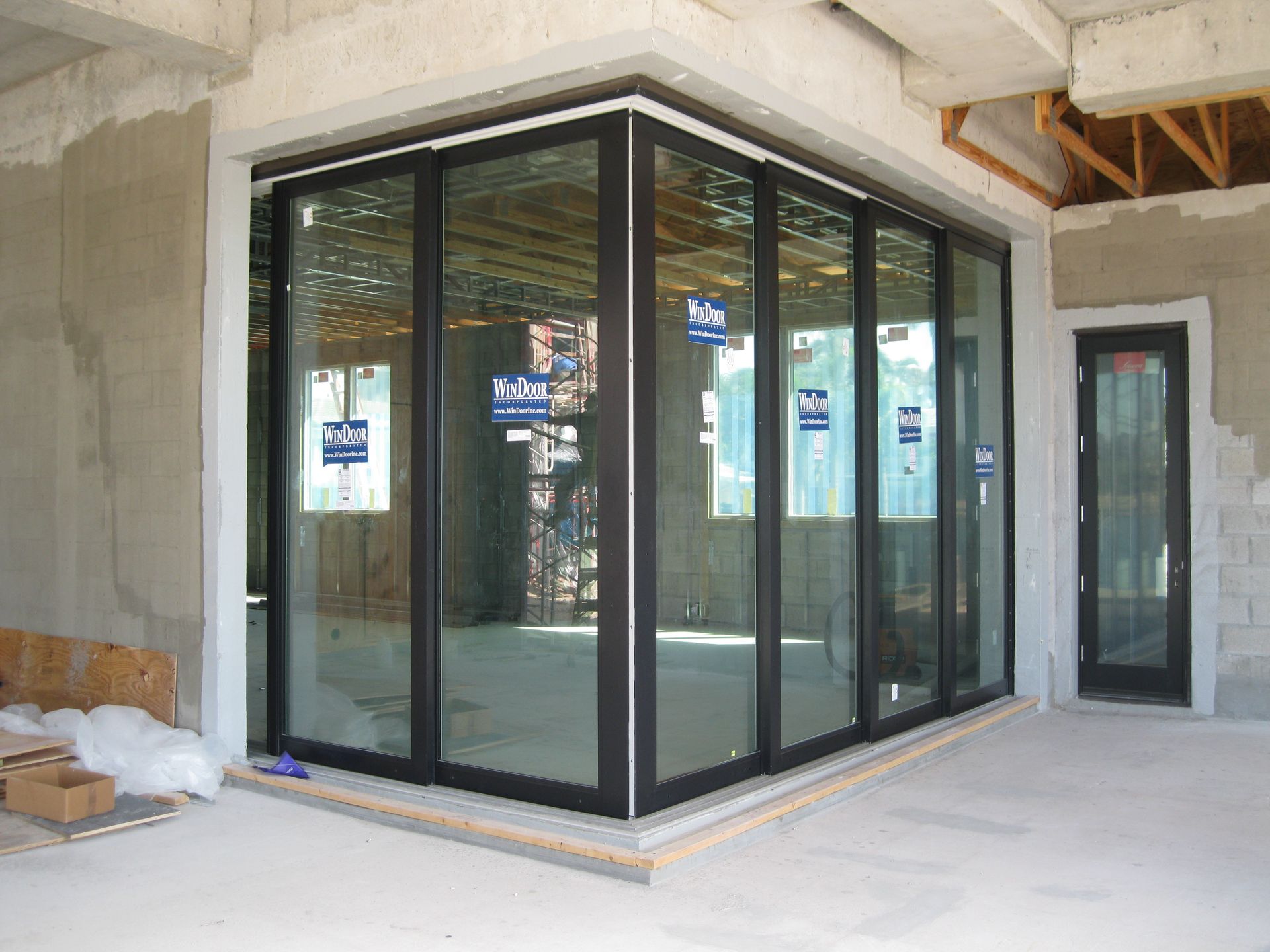 A building under construction with a lot of windows and doors