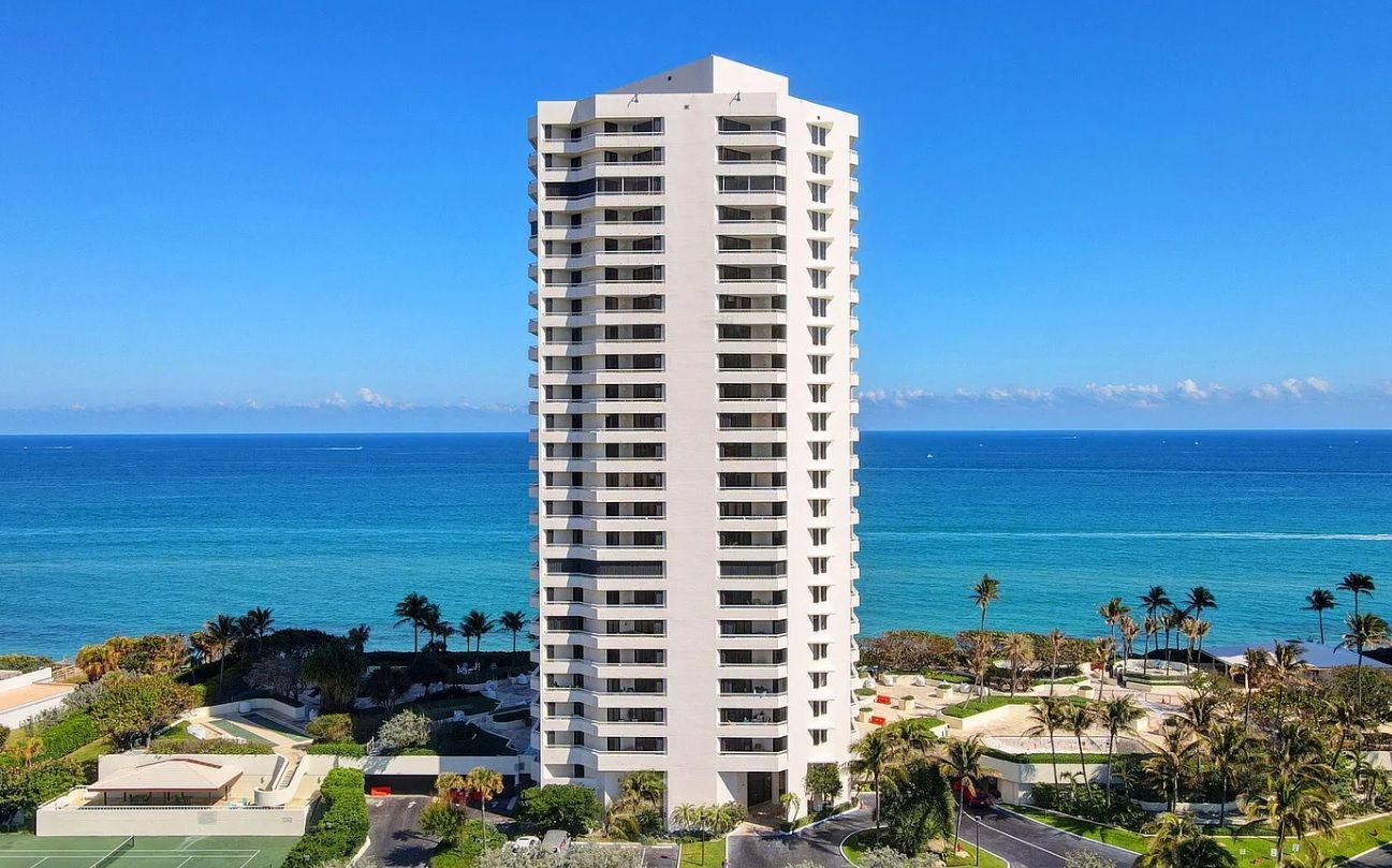 A tall building with a view of the ocean