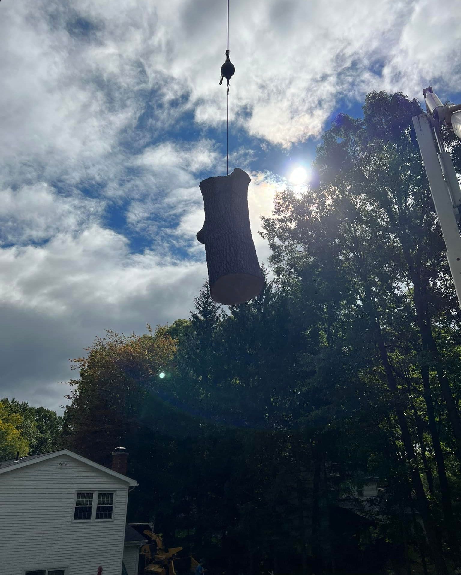 A large object is being lifted into the air by a crane.