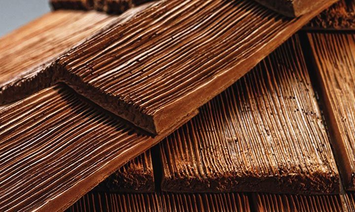 A close up of a wooden roof with shingles.