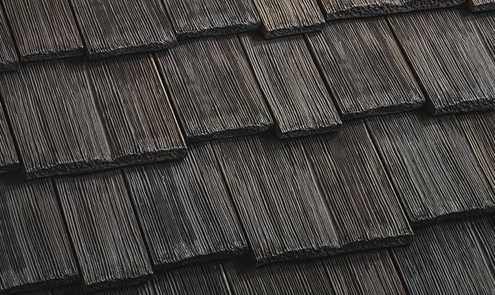 A close up of a wooden roof tile.