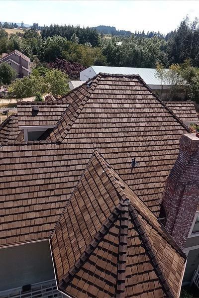 An aerial view of a house with a wooden roof