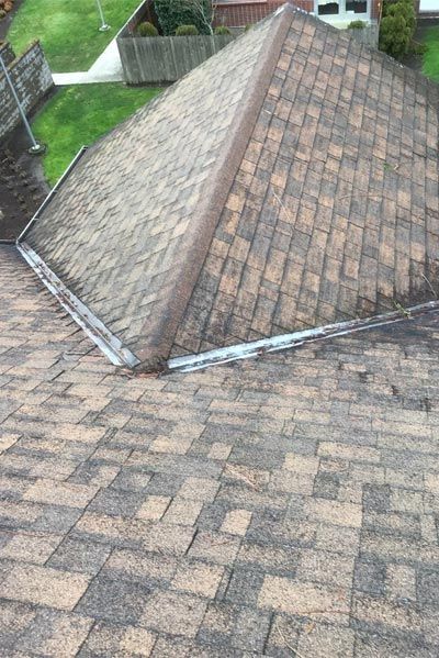 A close up of a roof with a gutter on it.