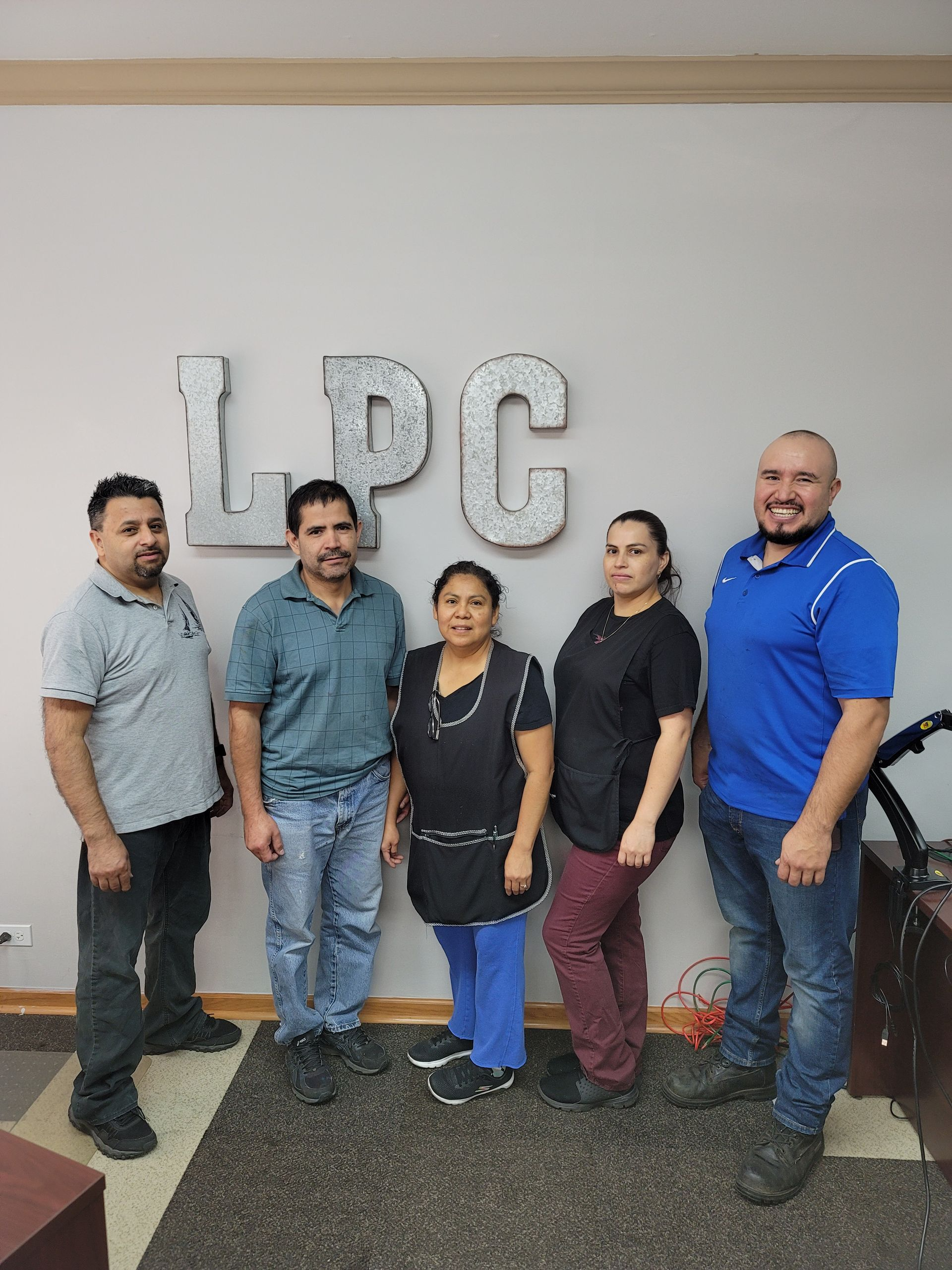 Five people standing in front of 