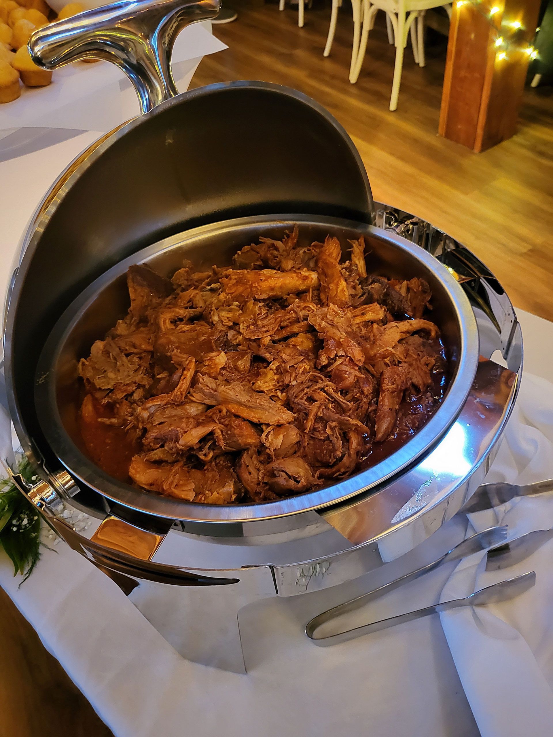 A buffet with BBQ is sitting on a table.