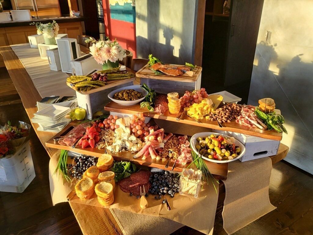 A buffet table with a variety of food on it.