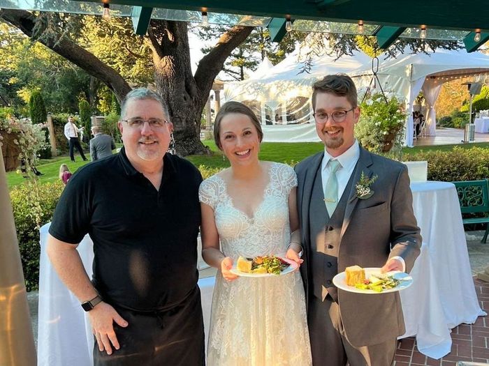 Outdoor wedding reception with catered dining area.