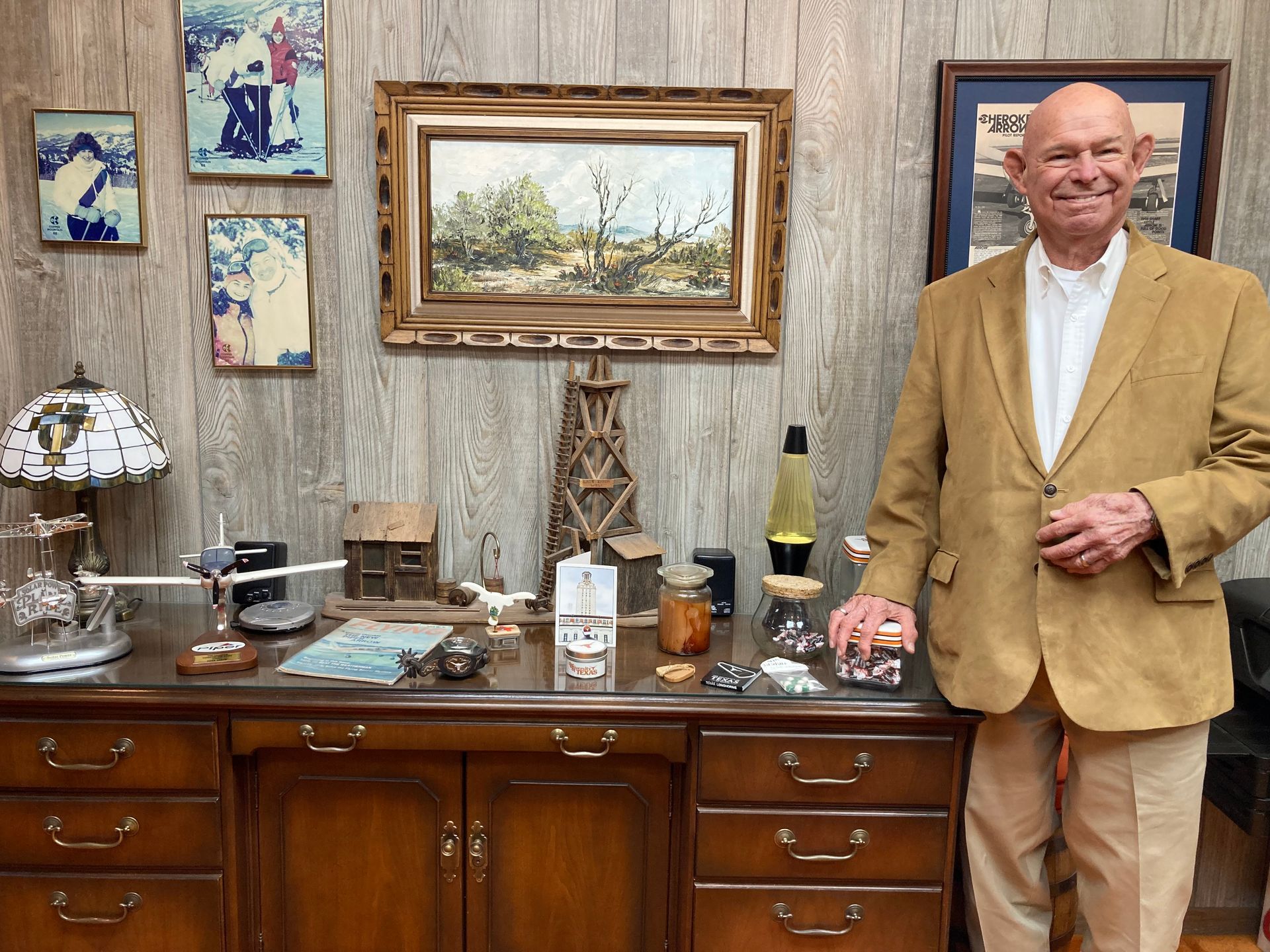 Silhouette of a person in a suit against a gray background.