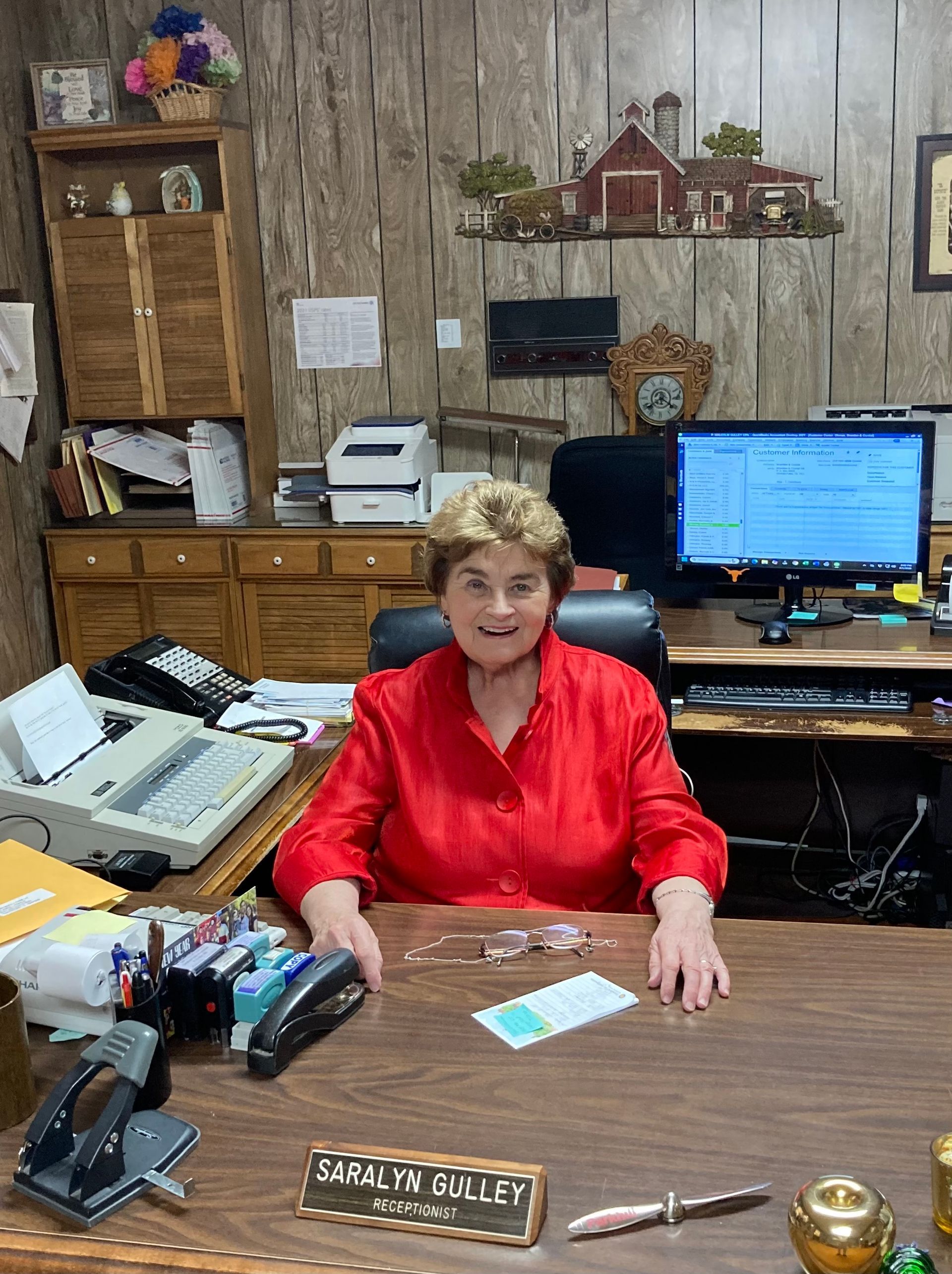 Silhouette of a person with shoulder-length hair, against a gray background.