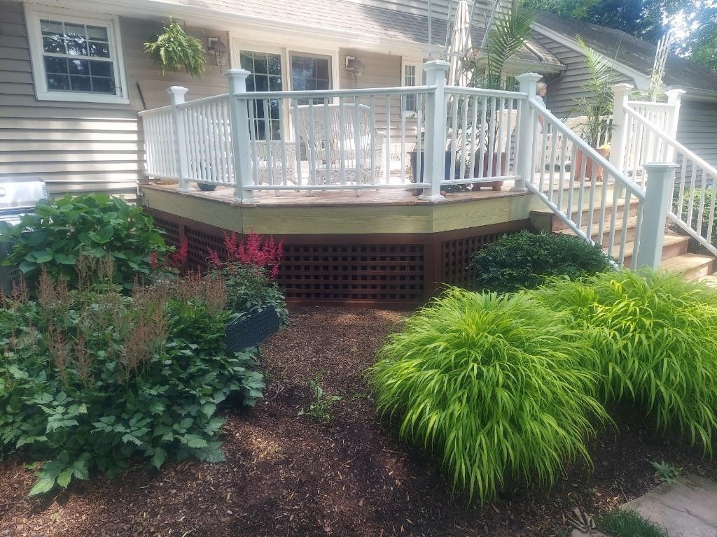 White deck railings with trees