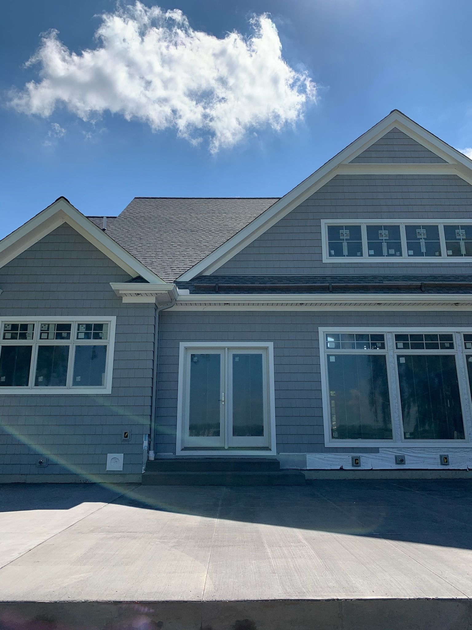 A house under construction with a blue sky in the background