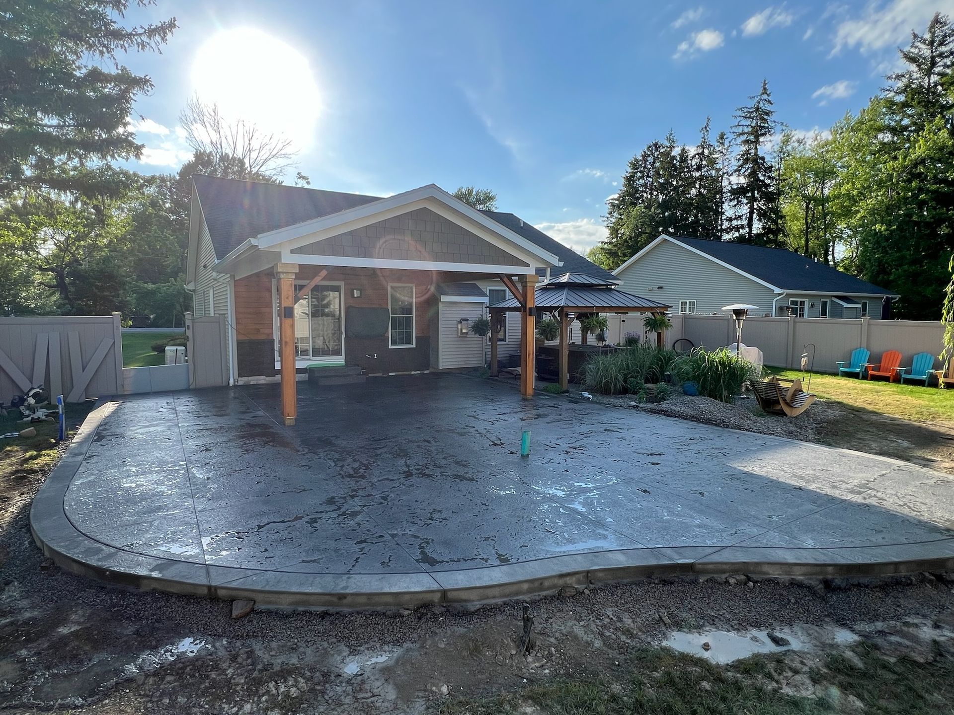 A house with a concrete driveway in front of it