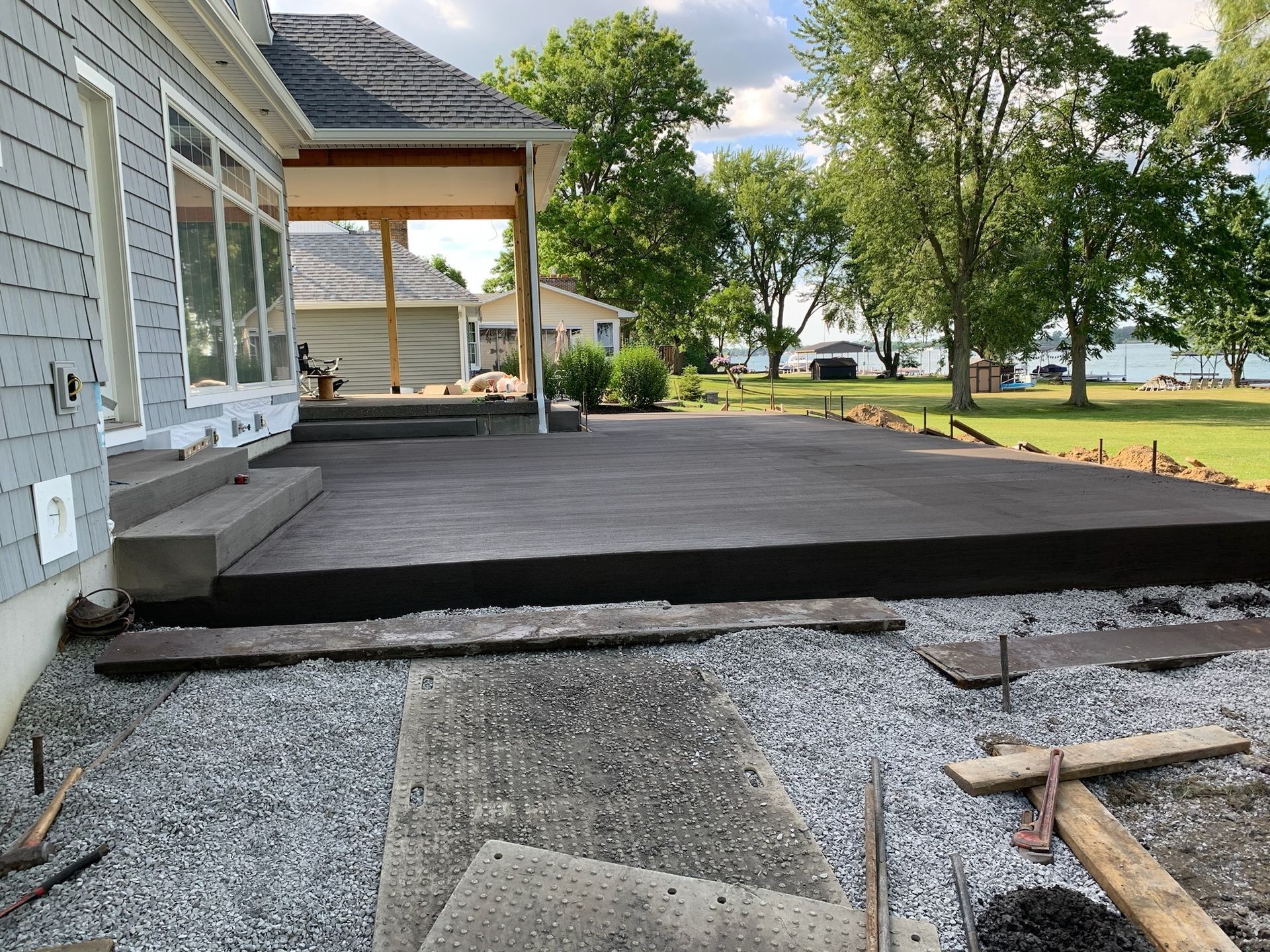 A large deck is being built in front of a house.