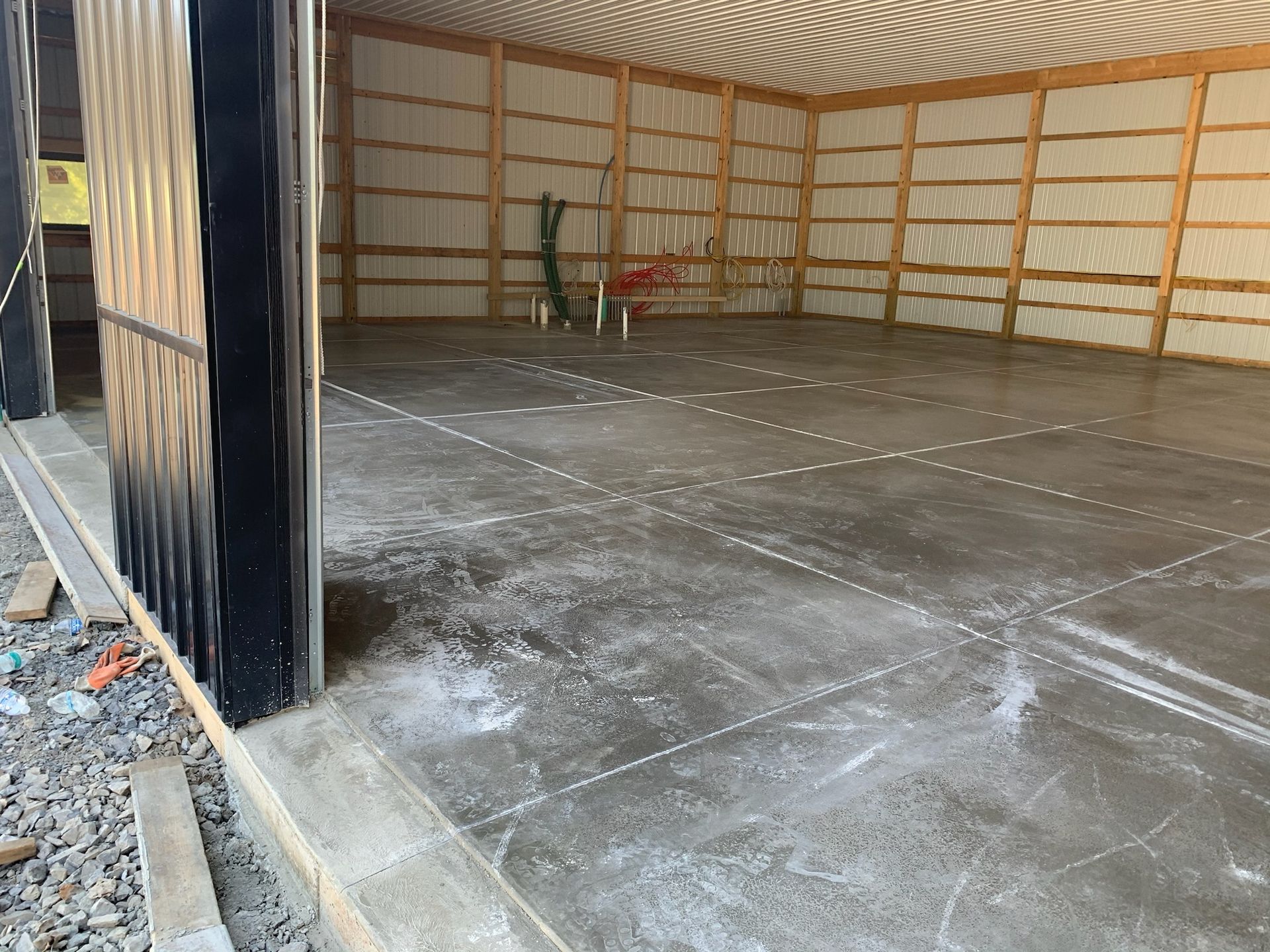 A large concrete floor in a building under construction.
