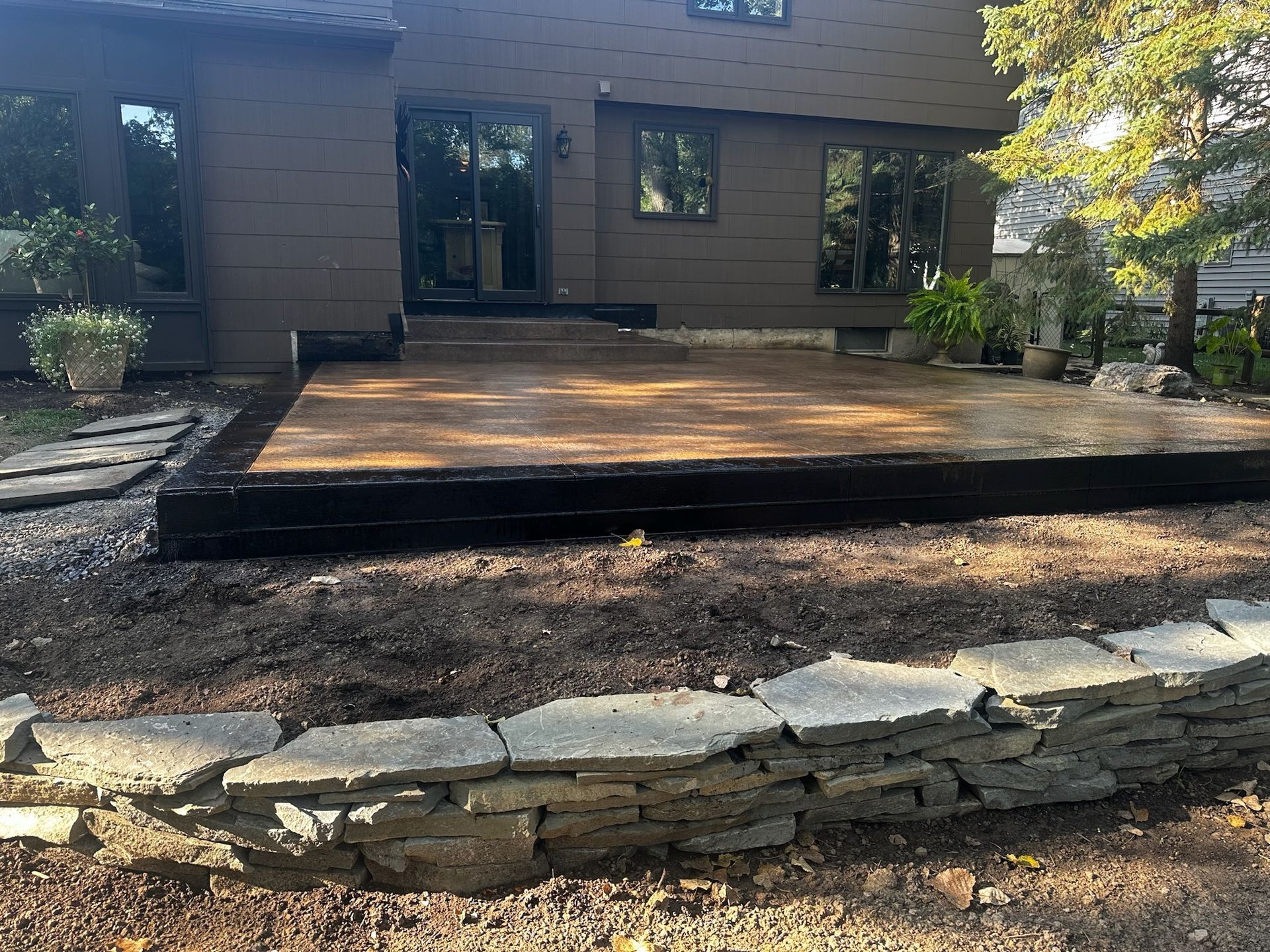 A large house with a large patio in front of it.