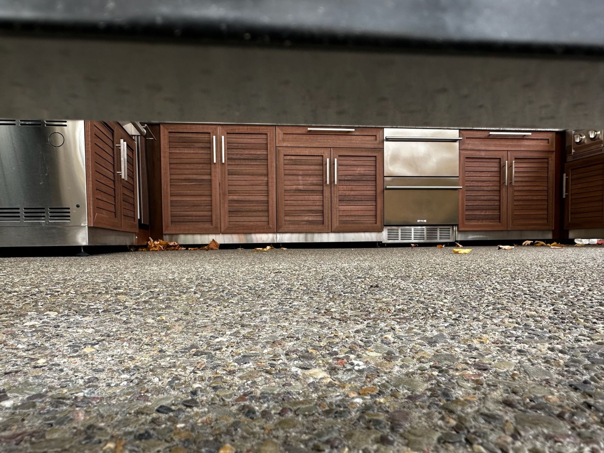 A kitchen with wooden cabinets and stainless steel appliances.