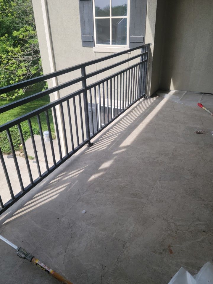 A balcony with a tile flooring