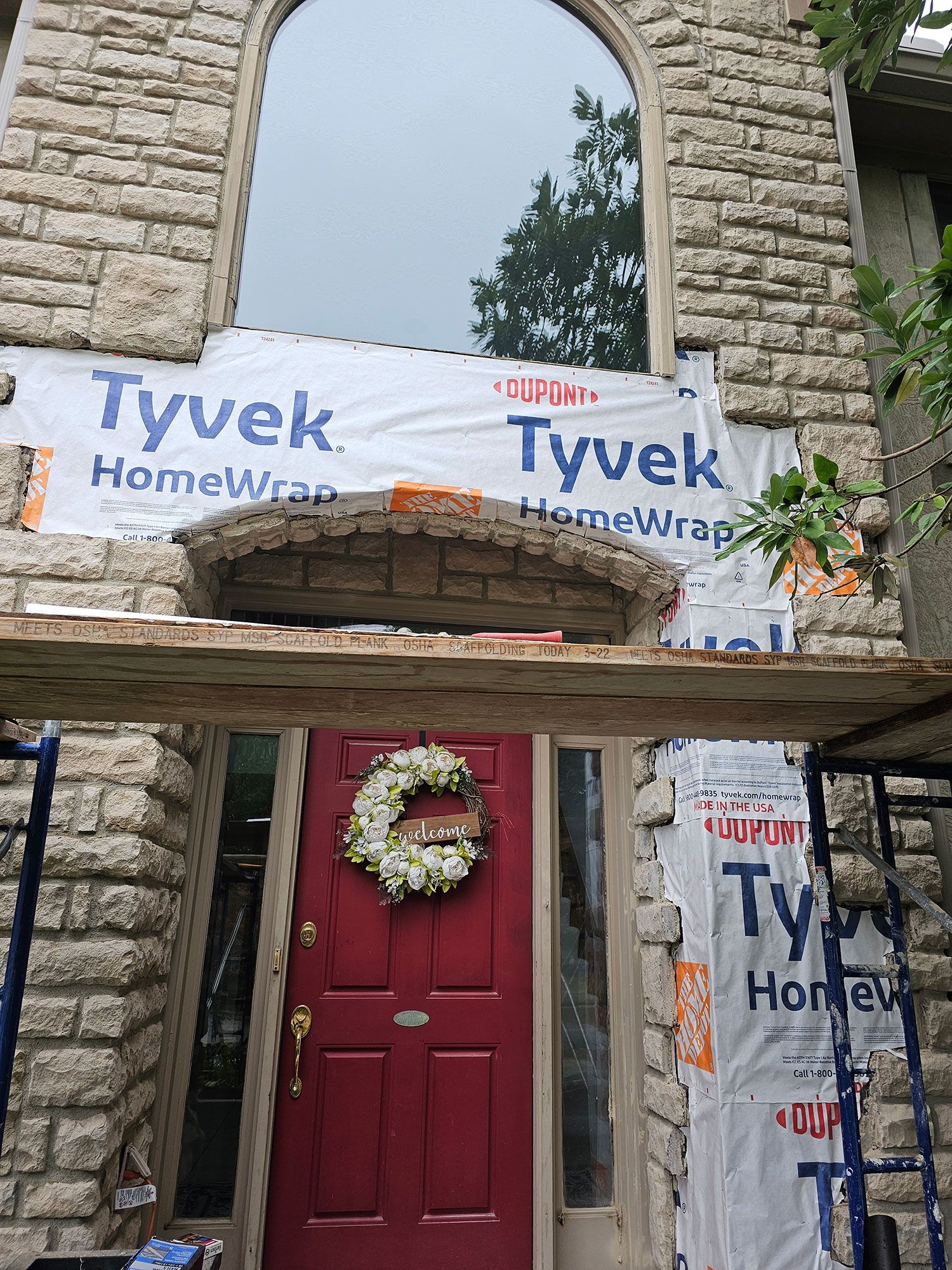Installation of stone wall in a house facade
