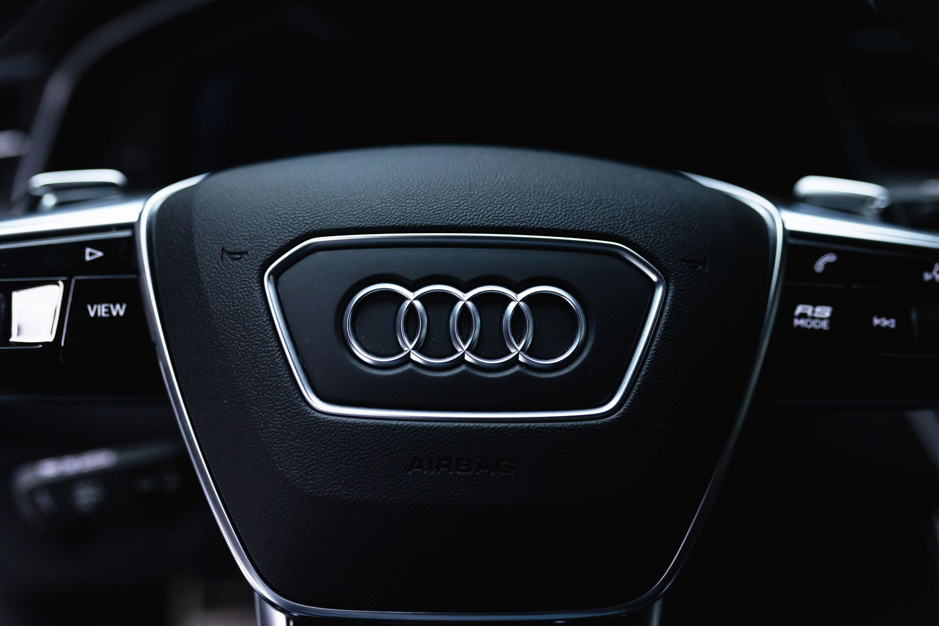 Audi steering wheel with illuminated logo and control buttons