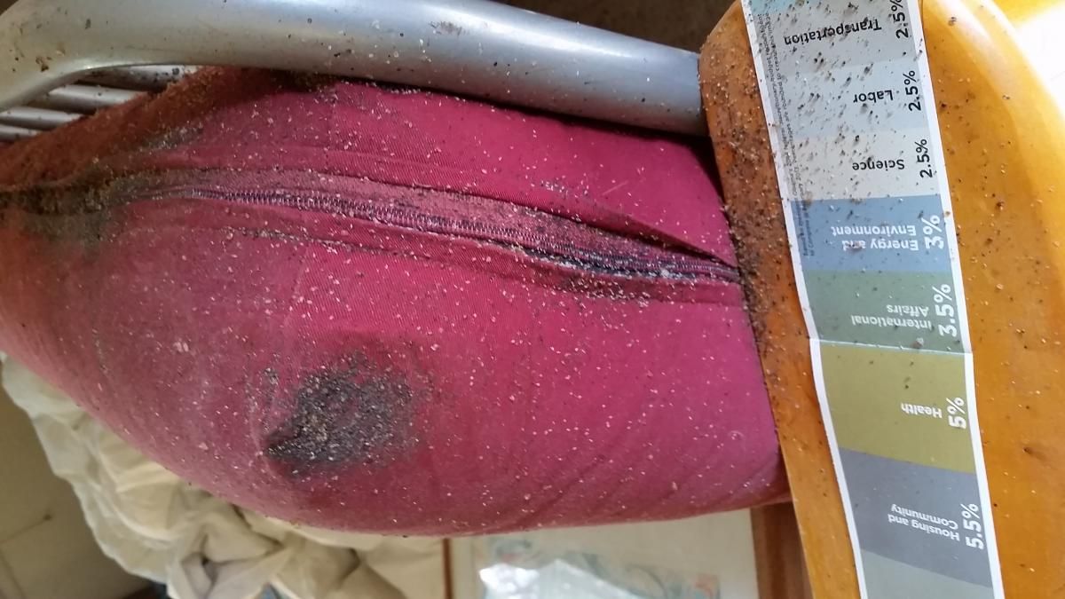 A close up of a pink item with a stain on it.