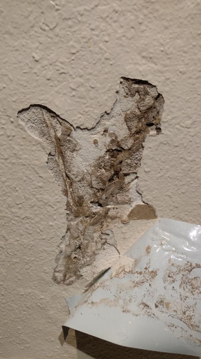 A close up of a hole in a wall.